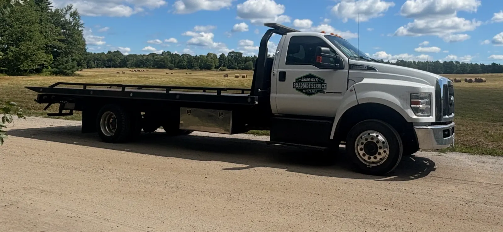 Brunswick Roadside Service Ford F-650 Flatbed Tow Truck with Logo